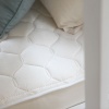 kids 2 in 1 ultra mattress naturepedic quilted side.jpeg