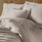 pdp organic relaxed linen duvetcover naturalchambray bedthreequarterdet f17 10 88ae08ea a04f 4d00 ac6b ff56710ea430.webp